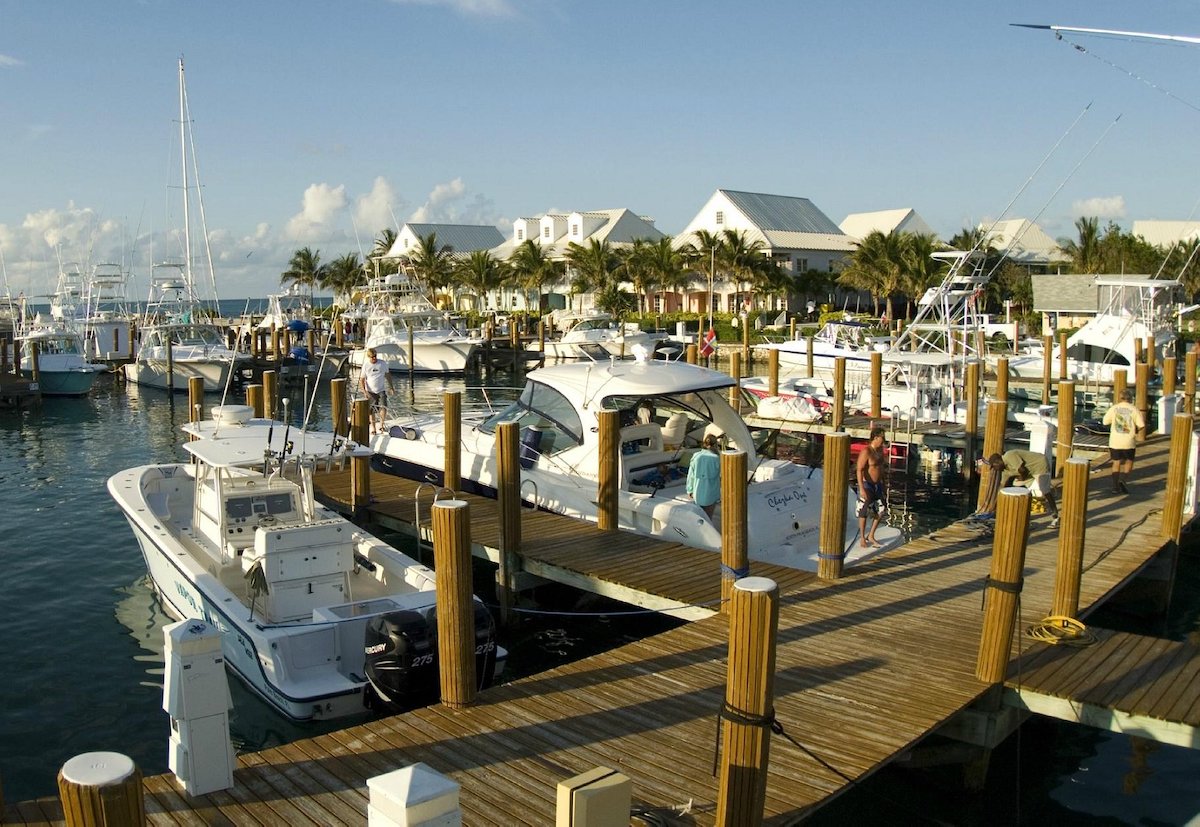 sailboats and motoboats are lined up in the marina at Old Bahama Bay resort