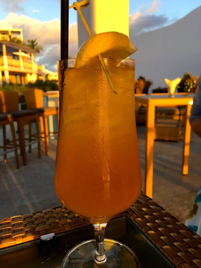 A rum swizzle cocktail at sunset  at the 1609 restaurant in hamilton, bermuda
