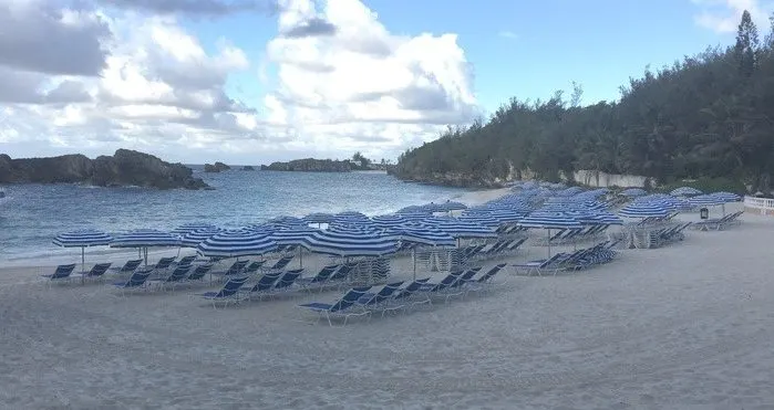 bermuda resorts often have access to lovely beaches like the fairmont's private cove protected bu off-shore boulders