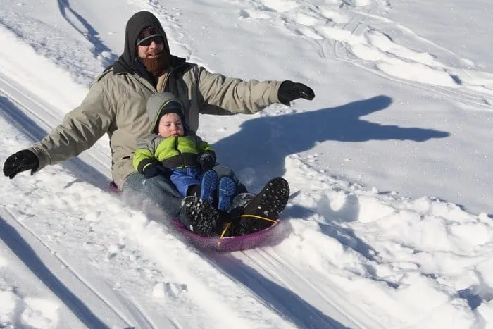 7 Brilliant Winter Vacation Ideas For Families That Don't Ski you can go sledding on a family winter vacation