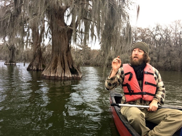 our bayou teche guide in a canoe on lake martin, louisiana