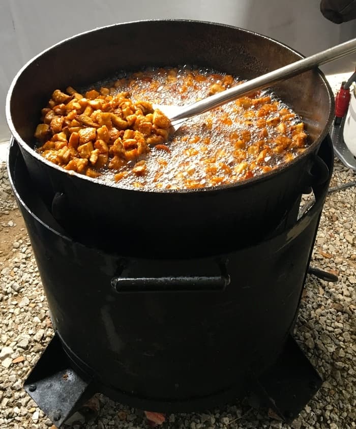 A big pot of hot frying pork cracklings