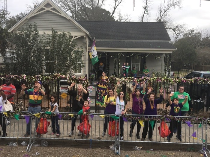 parade throwers waiting for trinkets on fat tuesday in lafayette, la.