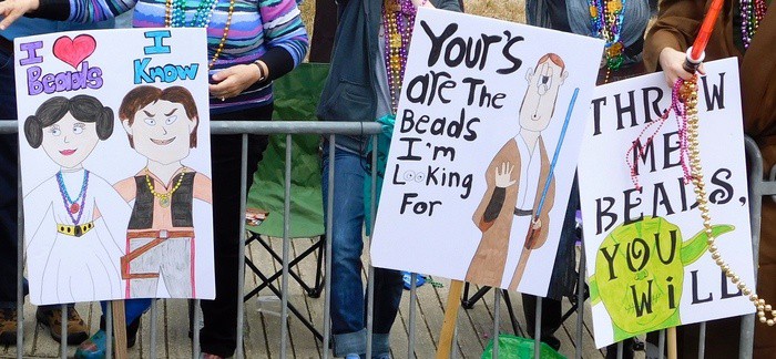 Signs to attract beads at a lafayette fat tuesday parade