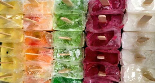 Fresh fruit paletas is a rainbow of colors at a costa rican ice cream stand