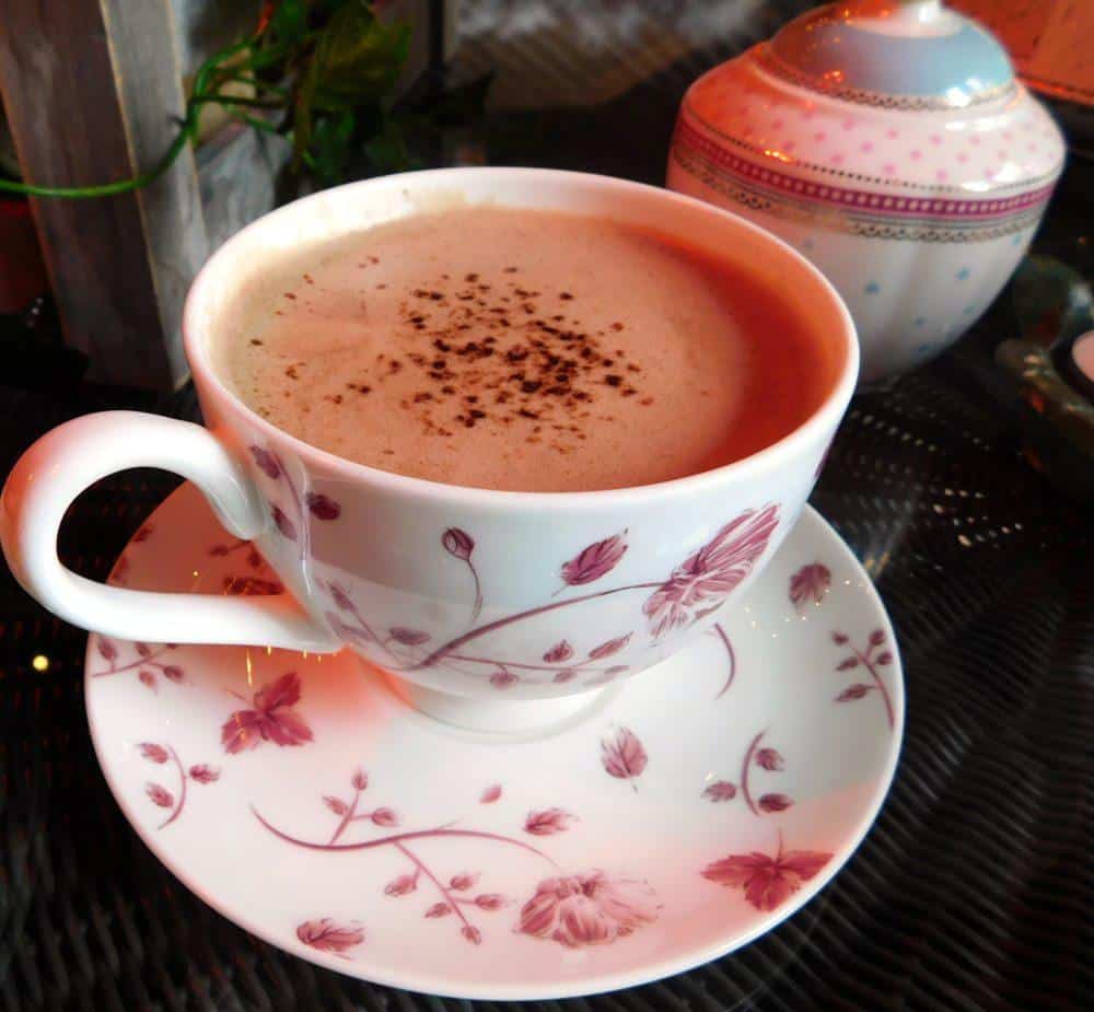 Hot chocolate a la st. Ermine's, served in pretty china with cocoa powder sprinkled on top.
