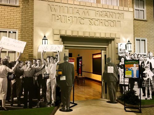 In the child heroes exhibit at the indianapolis childrens museum you can walk into school through the crowd of protestors ruby bridges faced.