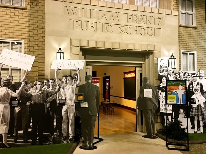 in the child heroes exhibit at the indianapolis childrens museum you can walk into school through the crowd of protestors ruby bridges faced.