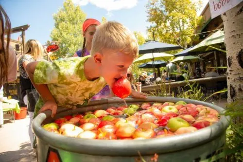 kids love bobbing for apples at the snowmass ciderfest