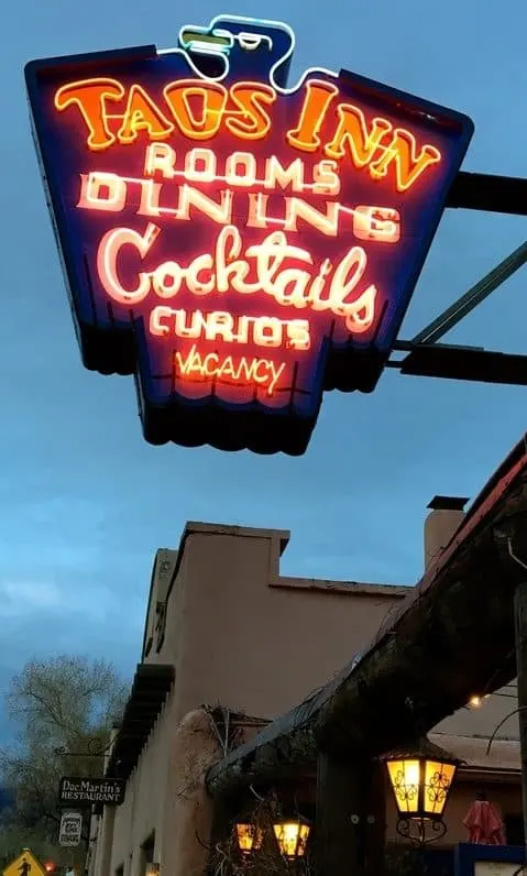 the neon sign at the historic taos inn