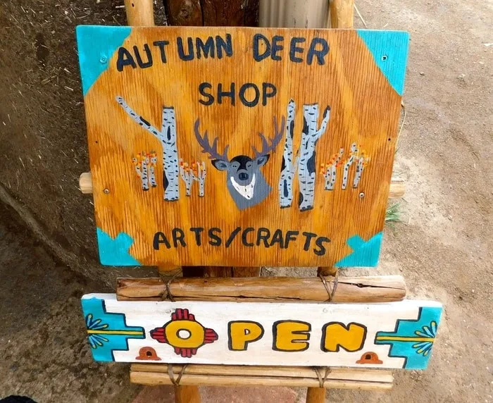 A sign for one of several pueblo shops