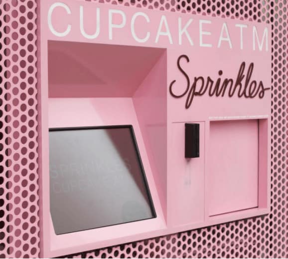 this pink atm in midtown manhattan dispenses cupcakes instead of cash.