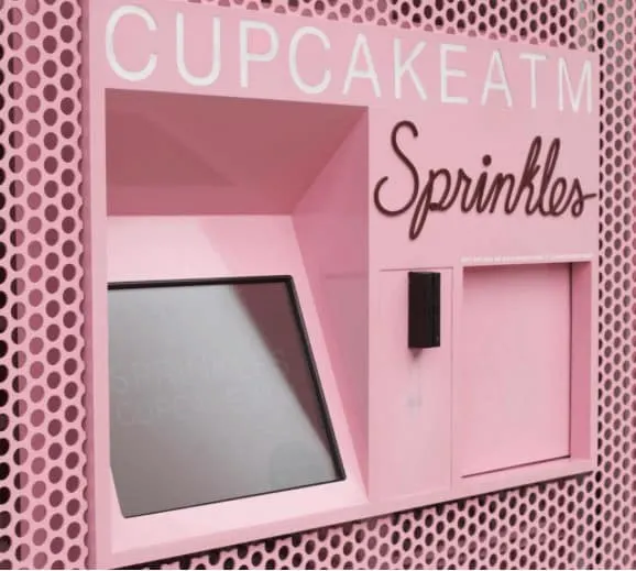 Midtown Nyc: 10 Things To Do With Kids this pink atm in midtown manhattan dispenses cupcakes instead of cash.