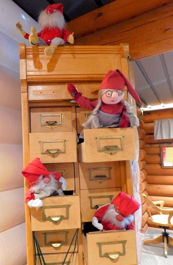 Tiny elves keeping busy at santa's post office at the arctic circle