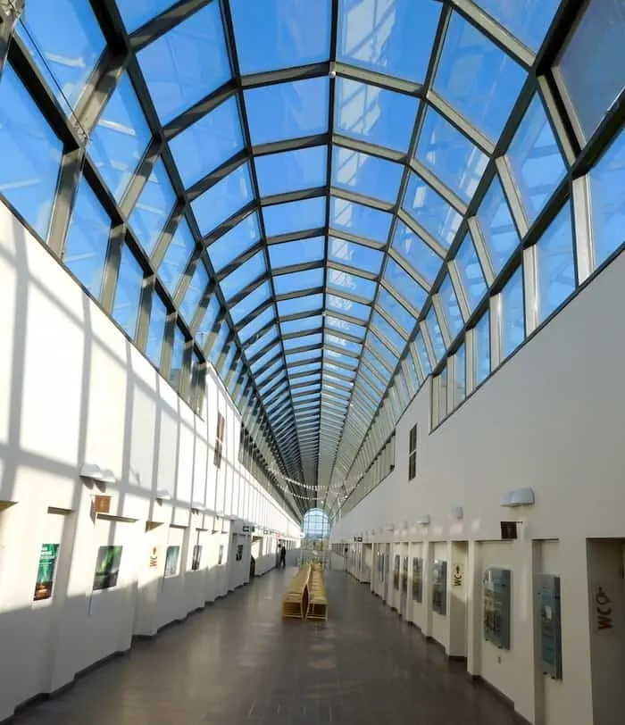 the long sunlit hallway of the arktikum museum in rovaniemi