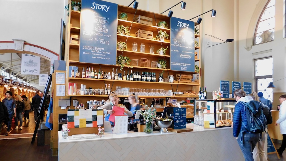 Helsinki's old market is in a bright white-washed building with attractive food stalls.