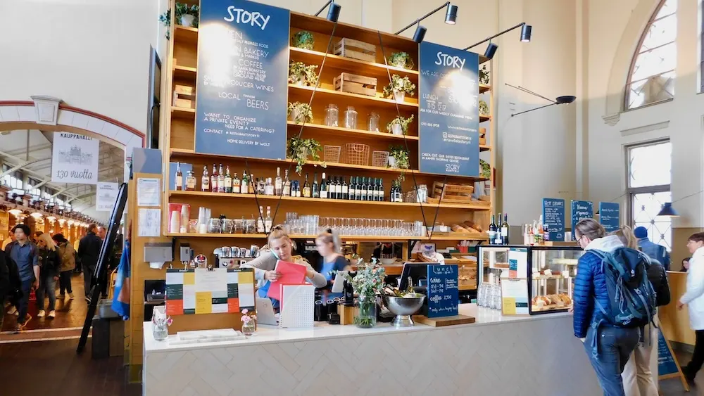 Helsinki's old market is in a bright white-washed building with attractive food stalls.