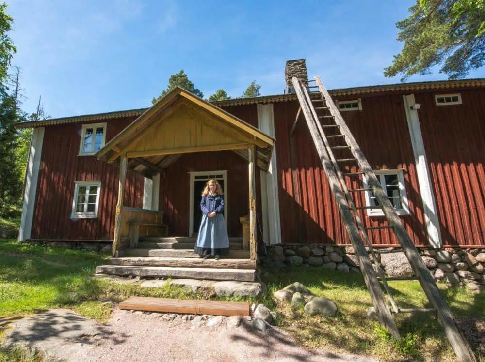 a costumed interpreter will guide you around the open air museum on suerasaari island.