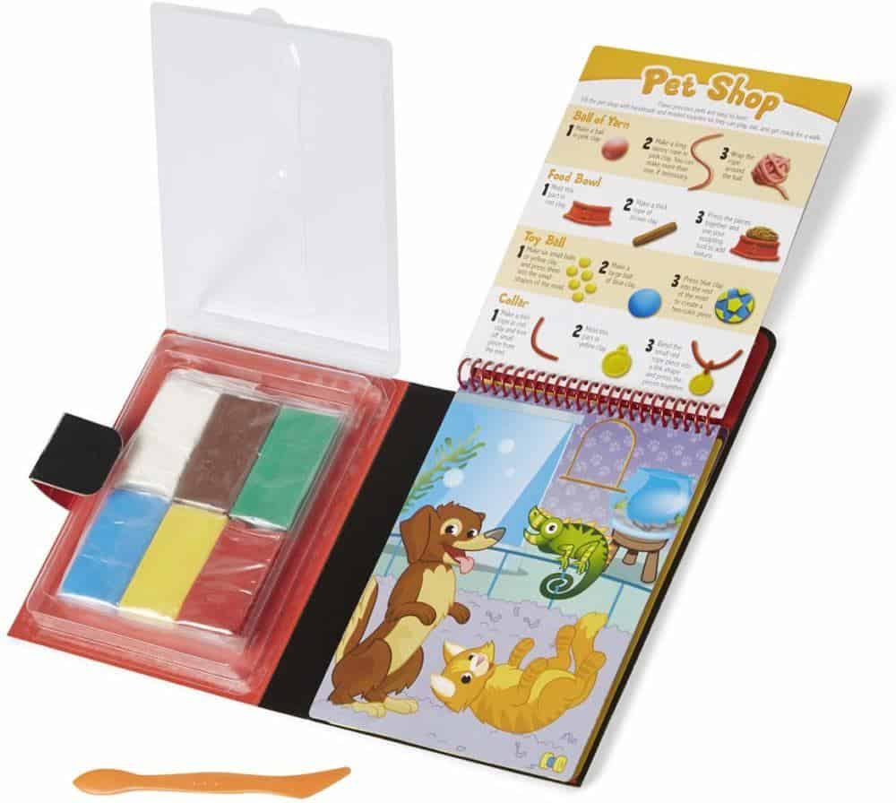 Melissa doug pack clay and an idea book into a compact travel kit.
