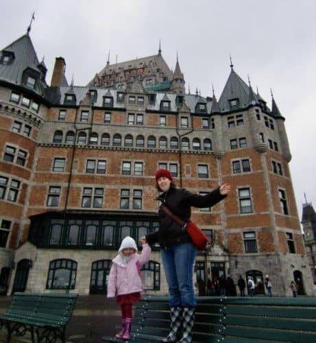 mother and daughter in front of castle-like chateau frontenac