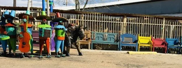 mariachis made out of metal are some of santa fe's colorful street art.