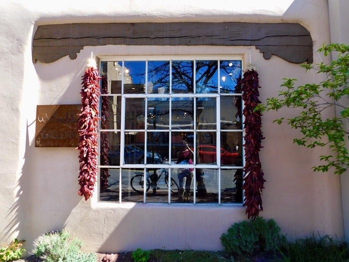 Peppers hang everywhere in new mexico, even alongside windows.