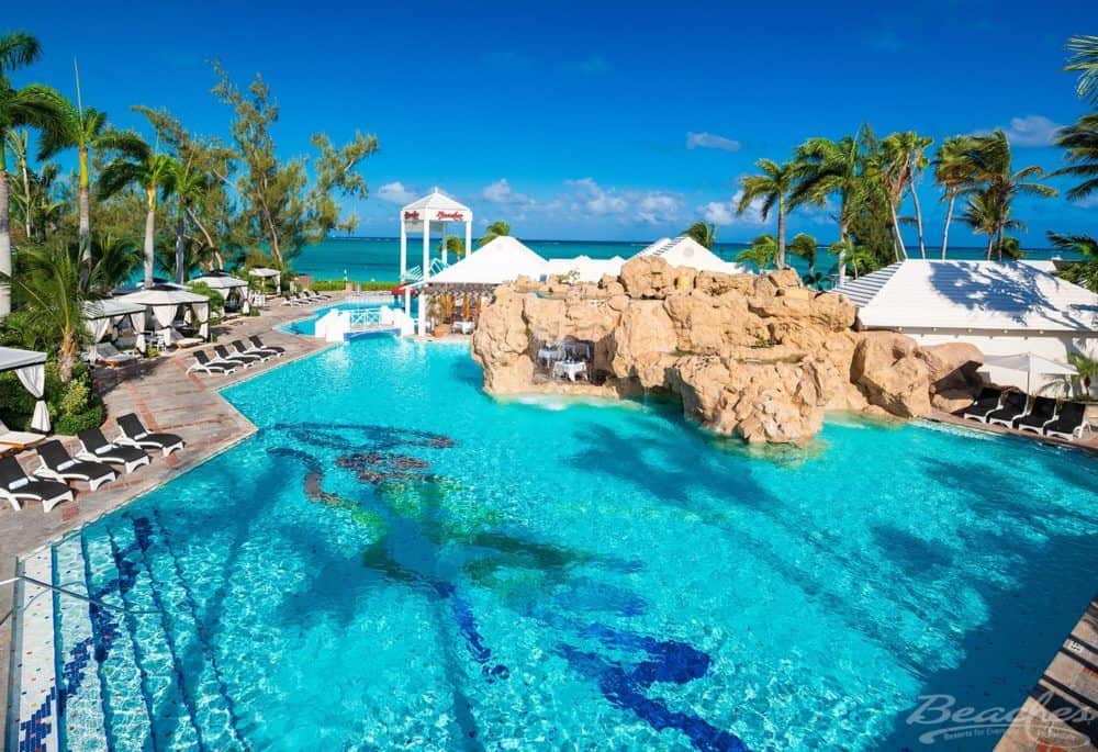 a landscaped pool at beaches resort