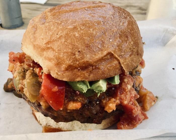 A burro alley burger with avocado and habanero jam.