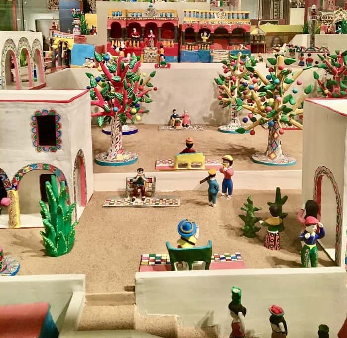 the colors of coco enrich this miniature mexican town at the museum if international folk art.