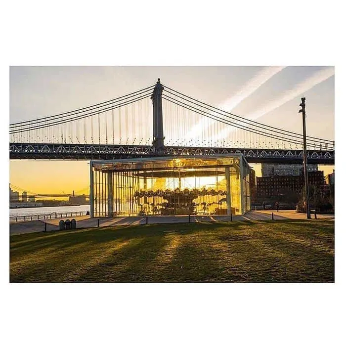 janes carousel sits beneath the brooklyn bridge and has river views. it's glass-enclosed, making it a yearround ride.