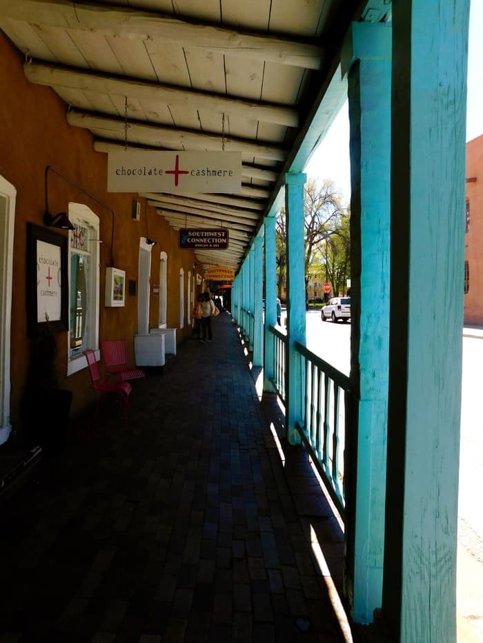 one of many covered sidewalks in santa fe's old town.