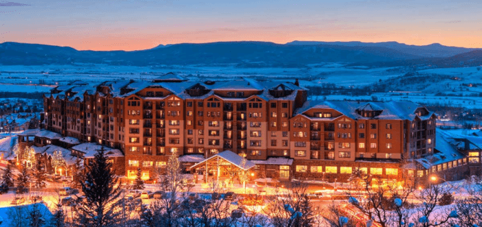 the steamboat grand hotel nestles into the towns ski hills.