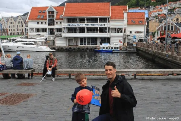 a map and a balloon. this father and son mix familiar and new while exploring bergen as a port of call.