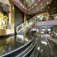 the MSC Divina relies on glitz for its ambience, like this dining room with gold detail.