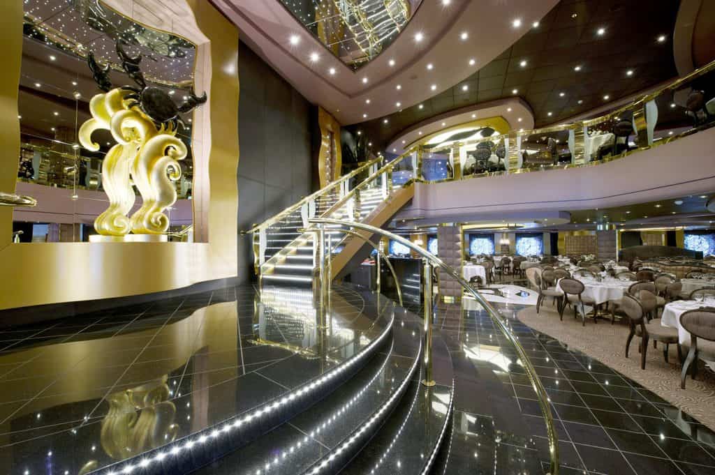 the MSC Divina relies on glitz for its ambience, like this dining room with gold detail.