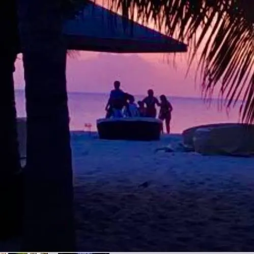 The Best Things To Do With Kids On 7 Caribbean Islands a family enjoys a sunset at jacqui o's on antigua