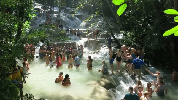 lots of tourists enjoying dunn's falls in jamaica