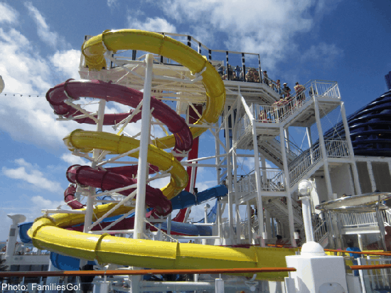 Norwegian cruies ships have fun water slides, like these red and yellow ones that twist around each other.