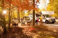 a family rv camping in the fall.