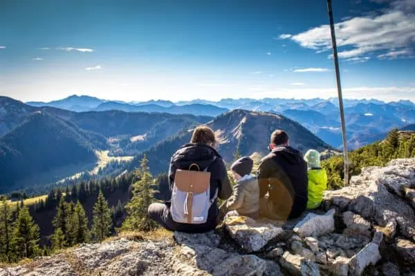 a family dressed warmly for fall hiking. 