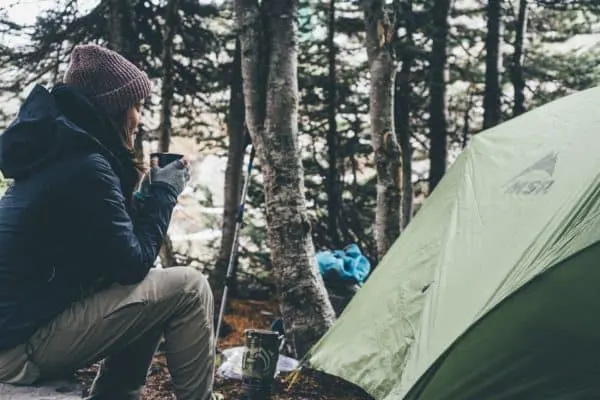 Fall Camping: The Only Packing List You'll Ever Need morning coffee by the fire is good on a chilly morning.