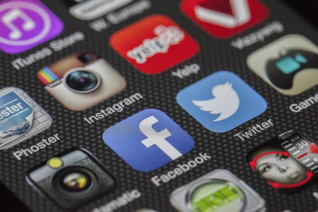 A phone screen full of social media apps.