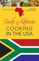 The cover of south african cooking in the usa features the national flag and typical dishes.