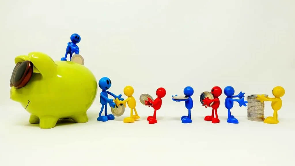 a tiny family passing along coins to put in a piggy bank that is bigger than they are.