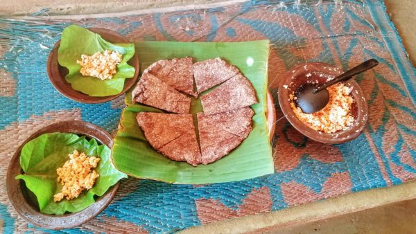 Sri lankan roti with coconut sambol for dipping.