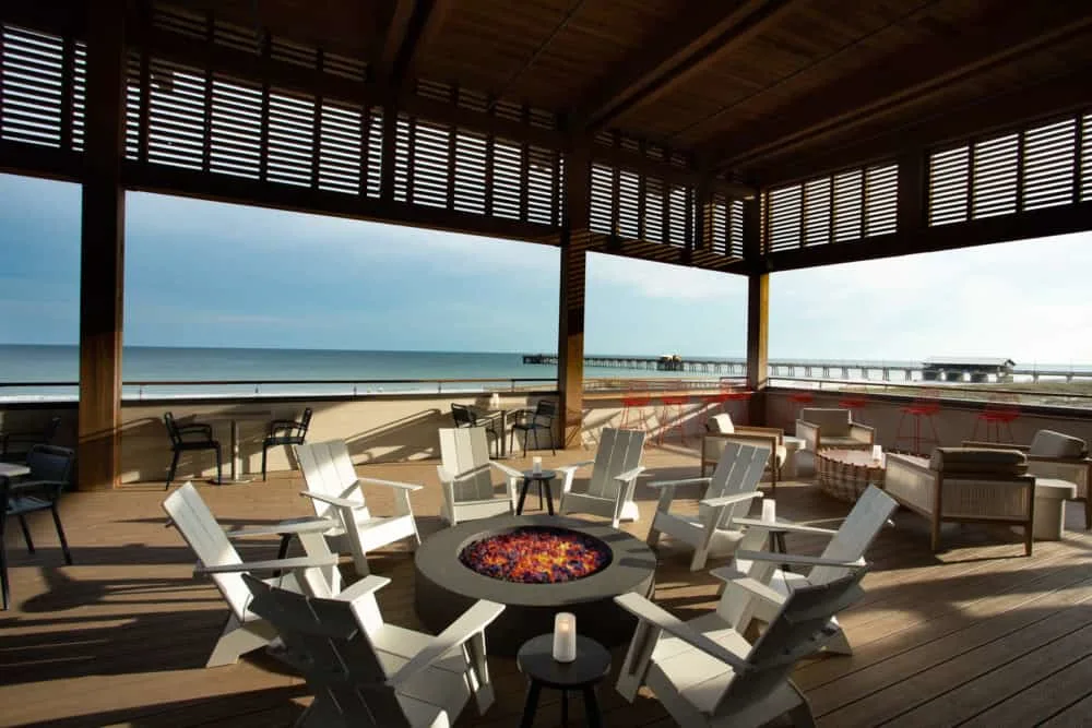 Take Your Kids To Gulf Shores, Al the expansive beach front deck with a fire pit at the lodge at gulf state park.