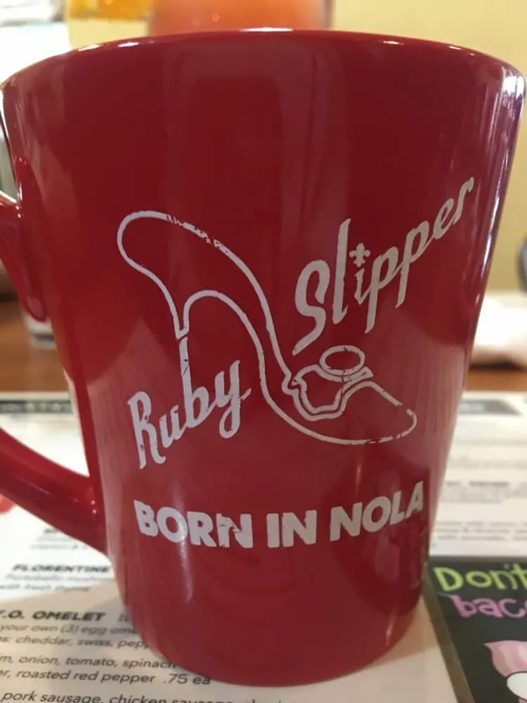 ruby slipper's bright red coffee mug.