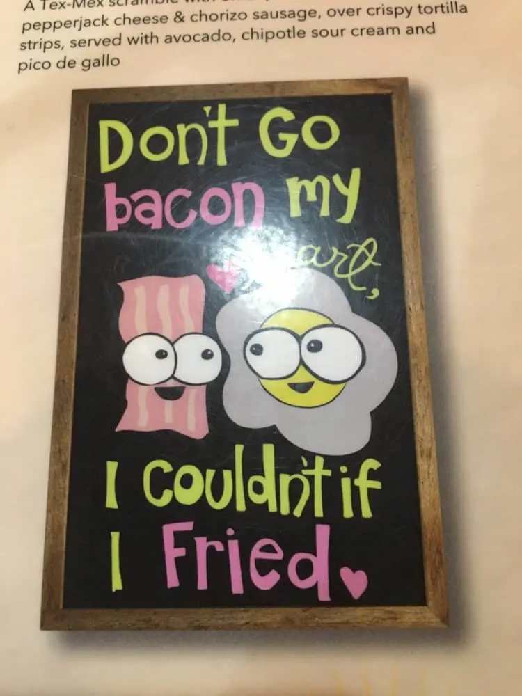 Take Your Kids To Gulf Shores, Al a punny sign about bacon and eggs at ruby slipper