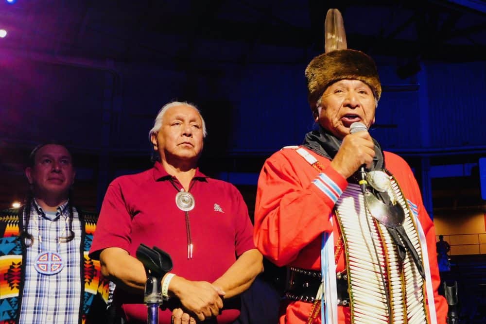 An elder opens the gathering of nations with a blessing