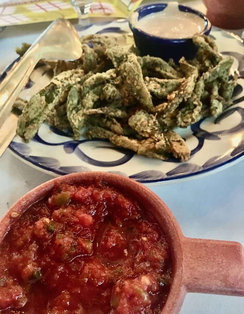 fried strips of pepper with fresh house salsa is a signature appetizer at el pinto in albuquerque.